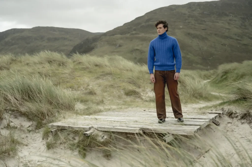 man in blue jumper on beach donegal